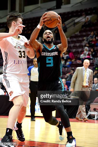 Aaron Harrison of the Greensboro Swarm goes to the basket against the Erie BayHawks as part of 2017 NBA D-League Showcase at the Hershey Centre on...