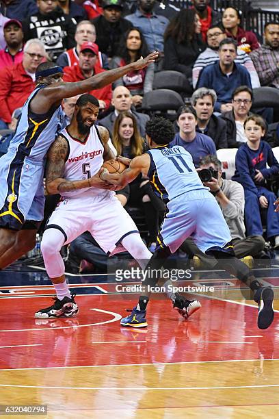 Washington Wizards forward Markieff Morris has the ball taken away by Memphis Grizzlies guard Mike Conley who is aided on defense by forward Zach...