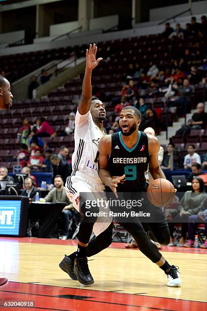Aaron Harrison of the Greensboro Swarm handles the ball against the Erie BayHawks as part of 2017 NBA D-League Showcase at the Hershey Centre on...
