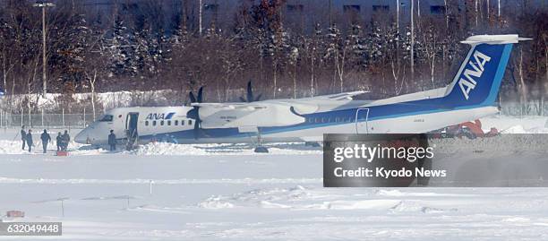 An All Nippon Airways plane overruns and stops outside a runway at New Chitose Airport near Sapporo on Japan's northernmost main island of Hokkaido...