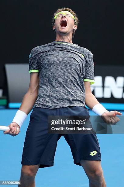 Denis Istomin of Uzbekistan celebrates winning his second round match against Novak Djokovic of Serbia on day four of the 2017 Australian Open at...