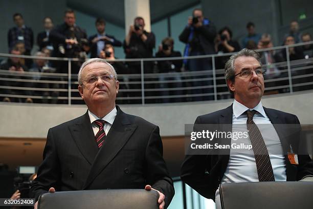 Martin Winterkorn , former CEO of German automaker Volkswagen AG, and VW executive Gerwin Postel arrive to testify at the Bundestag commission...