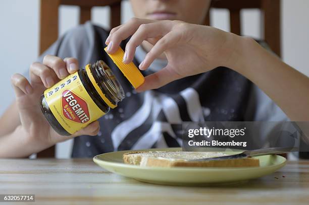 Consumer opens a jar of Vegemite spread in an arranged photograph in Melbourne, Australia, on Thursday Jan. 19, 2017. Bega Cheese Ltd., who has...