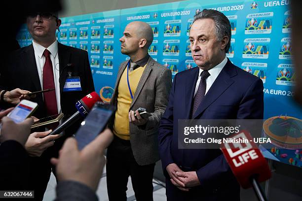 Deputy Prime Minister of the Russian Federation Vitaly Mutko speaks during an interview in the flash area during the official EURO 2020 logo...