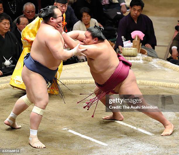 Mitakeumi and Takarafuji compete during day twelve of the Grand Sumo New Year Tournament at Ryogoku Kokugikan on January 19, 2017 in Tokyo, Japan.