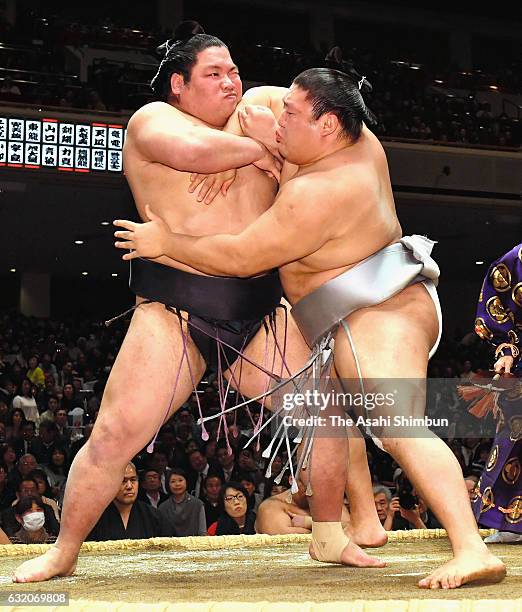 Mongolian wrestler Takanoiwa and Nishikigi compete during day twelve of the Grand Sumo New Year Tournament at Ryogoku Kokugikan on January 19, 2017...