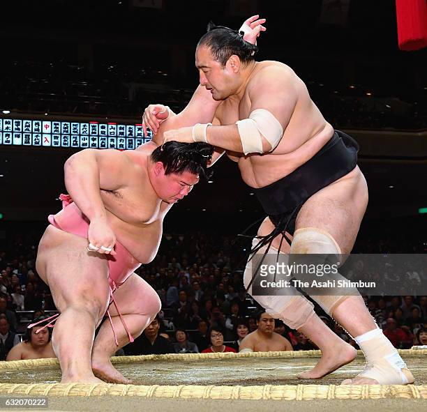 Ura and Aminishiki compete in the Juryo rank during day twelve of the Grand Sumo New Year Tournament at Ryogoku Kokugikan on January 19, 2017 in...