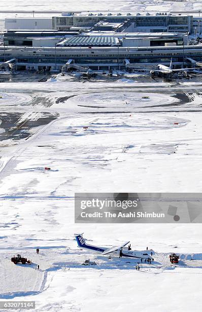 In this aerial image, an All Nippon Airways airplane is seen outside the runway at New Chitose Airport on January 19, 2017 in Chitose, Hokkaido,...