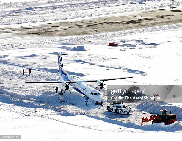 In this aerial image, an All Nippon Airways airplane is seen outside the runway at New Chitose Airport on January 19, 2017 in Chitose, Hokkaido,...