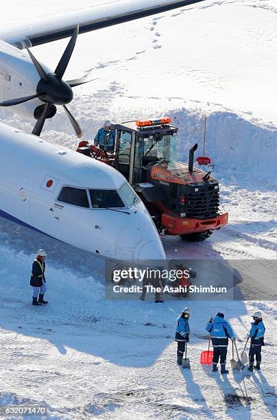 In this aerial image, an All Nippon Airways airplane is seen outside the runway at New Chitose Airport on January 19, 2017 in Chitose, Hokkaido,...