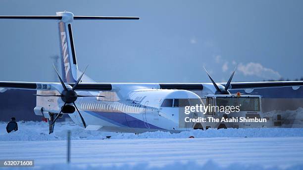 An All Nippon Airways airplane is seen outside the runway at New Chitose Airport on January 19, 2017 in Chitose, Hokkaido, Japan. No injuries...