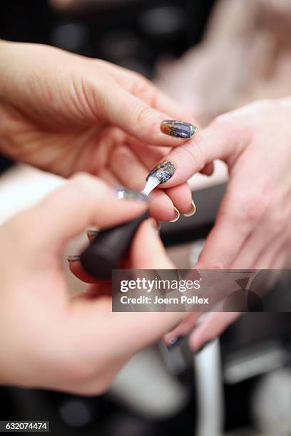 Model, hand detail, is seen backstage ahead of the Steinrohner show during the Mercedes-Benz Fashion Week Berlin A/W 2017 at Kaufhaus Jandorf on...