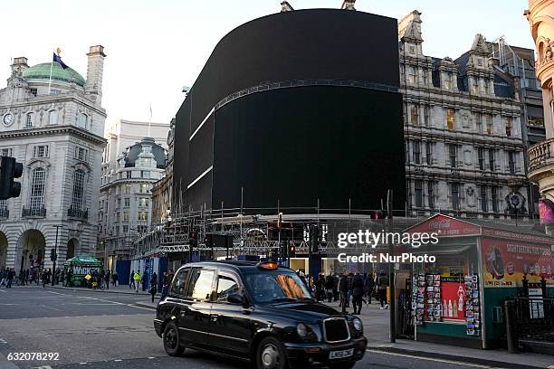 The billboard lights in London's Piccadilly circus have been turned off as work begins on replacing them with LED lights on 19 January 2017.