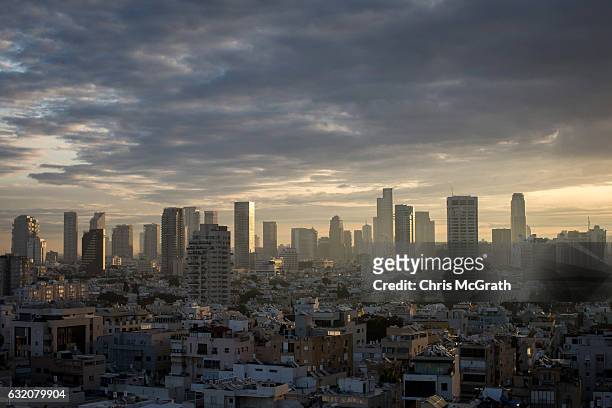 The Tel Aviv skyline is seen at sunrise on January 15, 2017 in Tel Aviv, Israel. 70 countries attended the recent Paris Peace Summit and called on...