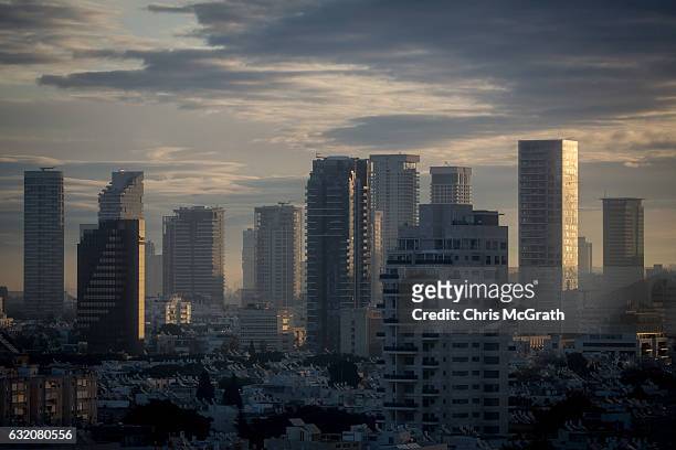 The Tel Aviv skyline is seen at sunrise on January 15, 2017 in Tel Aviv, Israel. 70 countries attended the recent Paris Peace Summit and called on...
