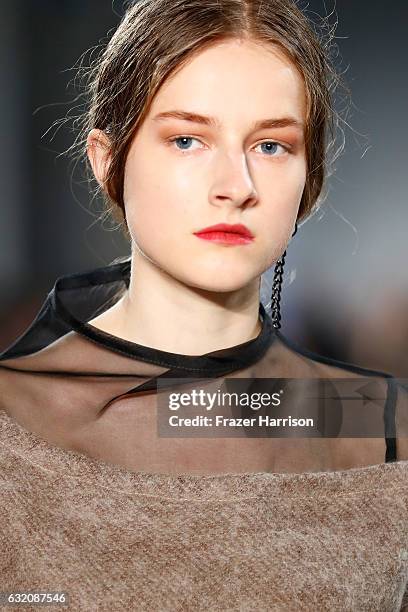 Model walks the runway at the Vladimir Karaleev show during the Mercedes-Benz Fashion Week Berlin A/W 2017 at Kaufhaus Jandorf on January 19, 2017 in...