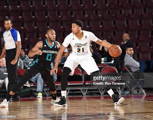 Anthony Brown of the Erie Bayhawks handles the ball against Rasheed Sulaimon of the Greensboro Swarm as part of 2017 NBA D-League Showcase at the...