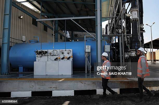 Palestinian employee works at a desalination plant during the inauguration of the first phase of the project on January 19 in Deir el-Balah in...