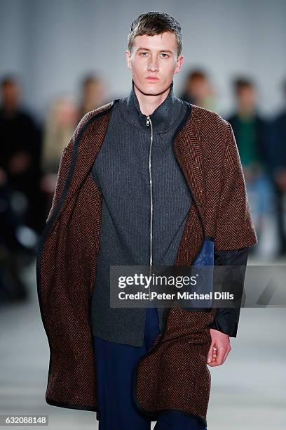 Model walks the runway at the Vladimir Karaleev show during the Mercedes-Benz Fashion Week Berlin A/W 2017 at Kaufhaus Jandorf on January 19, 2017 in...