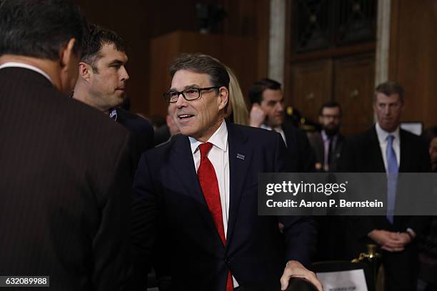 Former Texas Governor Rick Perry, President-elect Donald Trump's choice as Secretary of Energy, arrives for his confirmation hearing before the...