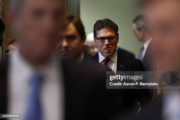 Former Texas Governor Rick Perry, President-elect Donald Trump's choice as Secretary of Energy, arrives for his confirmation hearing before the...