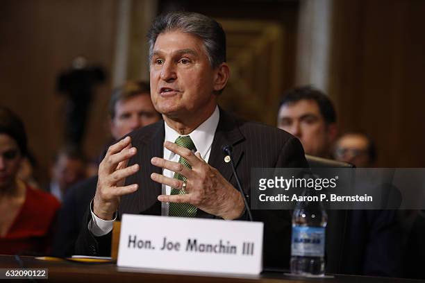 Sen. Joe Manchin introduces Former Texas Governor Rick Perry, President-elect Donald Trump's choice as Secretary of Energy, during his confirmation...