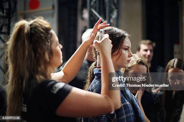 Model is seen backstage ahead of the Vladimir Karaleev show during the Mercedes-Benz Fashion Week Berlin A/W 2017 at Kaufhaus Jandorf on January 19,...