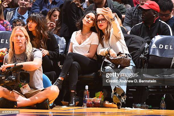 Actress, Vanessa Hudgens and Ashley Tisdale take a 'selfie' during the Detroit Pistons game against the Los Angeles Lakers on January 15, 2017 at...