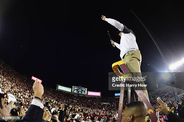 Trojans head coach Clay Helton celebrates after defeating the Penn State Nittany Lions 52-49 to win the 2017 Rose Bowl Game presented by Northwestern...