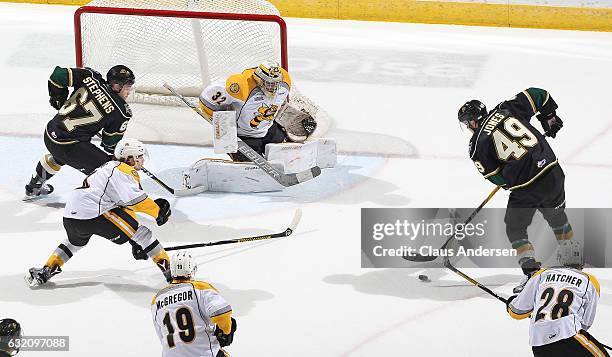 Max Jones and Mitchell Stephens of the London Knights break in on Justin Fazio of the Sarnia Sting during an OHL game at Budweiser Gardens on January...