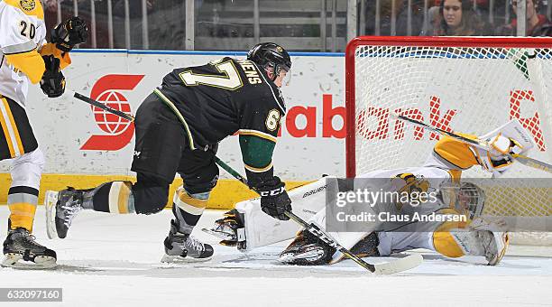 Mitchell Stephens of the London Knights is stopped by Justin Fazio of the Sarnia Sting during an OHL game at Budweiser Gardens on January 18, 2017 in...