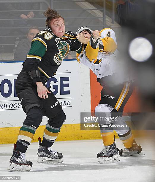 Max Jones of the London Knights dukes it out with Jeff King of the Sarnia Sting during an OHL game at Budweiser Gardens on January 18, 2017 in...