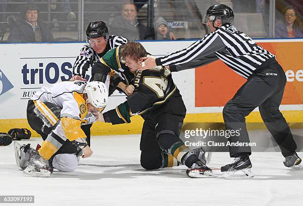 Max Jones of the London Knights dukes it out with Jeff King of the Sarnia Sting during an OHL game at Budweiser Gardens on January 18, 2017 in...