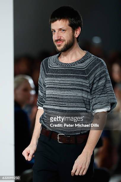 Designer Michael Sontag acknowledges the audience following his show during the Mercedes-Benz Fashion Week Berlin A/W 2017 at Kaufhaus Jandorf on...