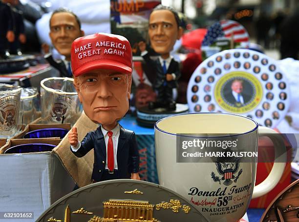 President-elect Donald Trump merchandise on sale outside the White House in Washington, DC, on January 19 as final preparations are underway a day...