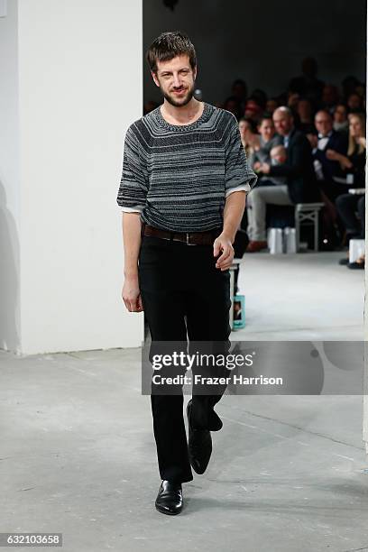 Designer Michael Sontag acknowledges the audience following his show during the Mercedes-Benz Fashion Week Berlin A/W 2017 at Kaufhaus Jandorf on...