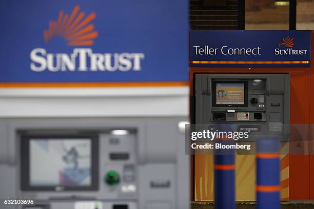 An automatic teller machine stands outside a SunTrust Banks Inc. Drive through branch in Goodlettsville, Tennessee, U.S., on Wednesday, Jan. 18,...