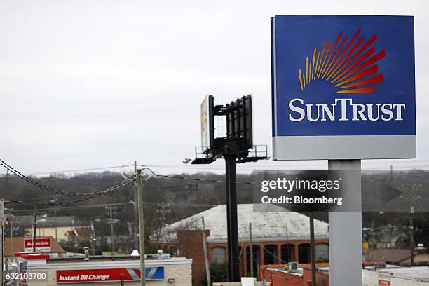 Signage is displayed outside a SunTrust Banks Inc. Drive through branch in Goodlettsville, Tennessee, U.S., on Wednesday, Jan. 18, 2017. SunTrust...