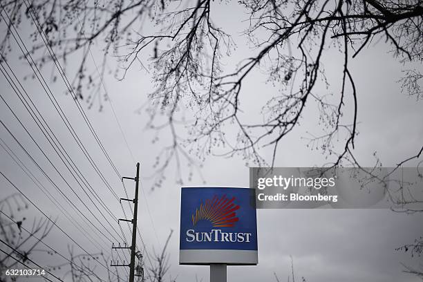 Signage is displayed outside a outside a SunTrust Banks Inc. Drive through branch in Goodlettsville, Tennessee, U.S., on Wednesday, Jan. 18, 2017....