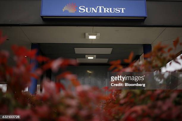 Signage is displayed outside a SunTrust Banks Inc. Drive through branch in Goodlettsville, Tennessee, U.S., on Wednesday, Jan. 18, 2017. SunTrust...