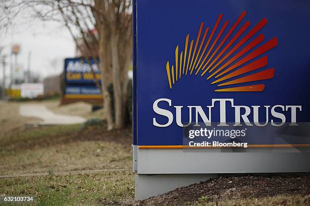 Signage is displayed outside a SunTrust Banks Inc. Branch in Hendersonville, Tennessee, U.S., on Wednesday, Jan. 18, 2017. SunTrust Banks Inc. Is...