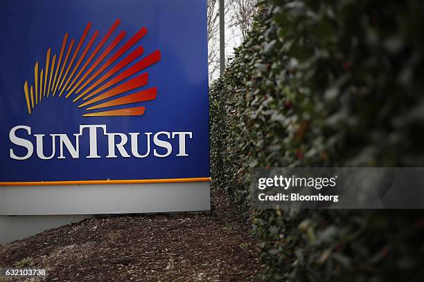 Signage is displayed outside a SunTrust Banks Inc. Branch in Hendersonville, Tennessee, U.S., on Wednesday, Jan. 18, 2017. SunTrust Banks Inc. Is...