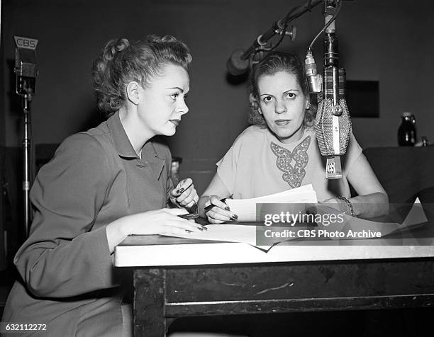 Actress June Lockhart and CBS Radio personality Radie Harris are photographed in front of a Radio Microphone. Radie Harris is the on air columnist...