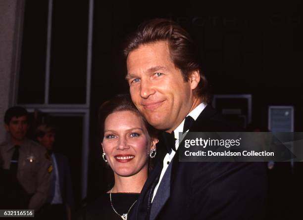 Actor Jeff Bridges and his wife Susan Geston pose for a portrait at an the Academy Awards in March 1987 in Los Angeles, California .