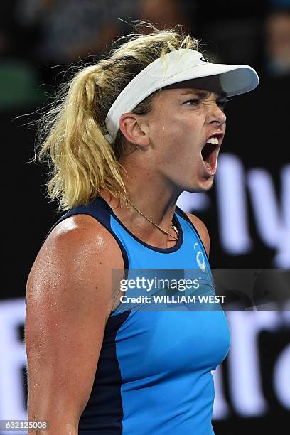 Coco Vandeweghe of the US reacts after a point against Canada's Eugenie Bouchard during their women's singles third round match on day five of the...