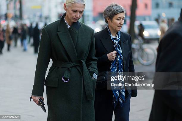 Christiane Arp wearing a green coat outside Vladimir Karaleev during the Mercedes-Benz Fashion Week Berlin A/W 2017 at Kaufhaus Jandorf on January...