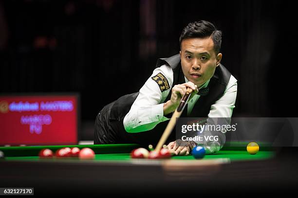 Marco Fu of Chinese Hong Kong plays a shot during the quarterfinal match against Mark Allen of Northern Ireland on day five of the Dafabet Masters at...