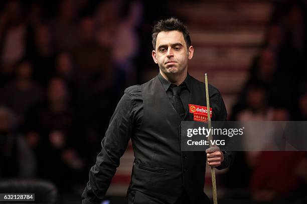 Ronnie O'Sullivan of England reacts during the quarterfinal match against Neil Robertson of Australia on day five of the Dafabet Masters at Alexandra...