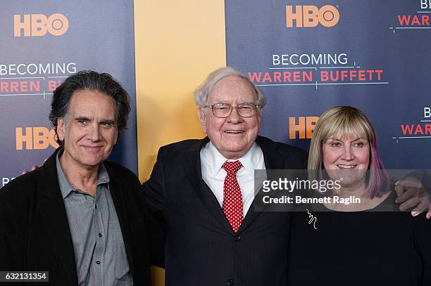 Warren Buffett poses for a picture with his children Peter Buffett and Susie Buffett during "Becoming Warren Buffett" World premiere at The Museum of...