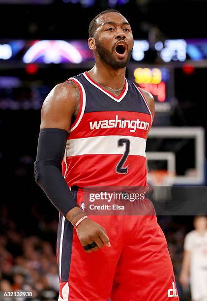 John Wall of the Washington Wizards celebrates in the fourth quarter against the New York Knicks at Madison Square Garden on January 19, 2017 in New...